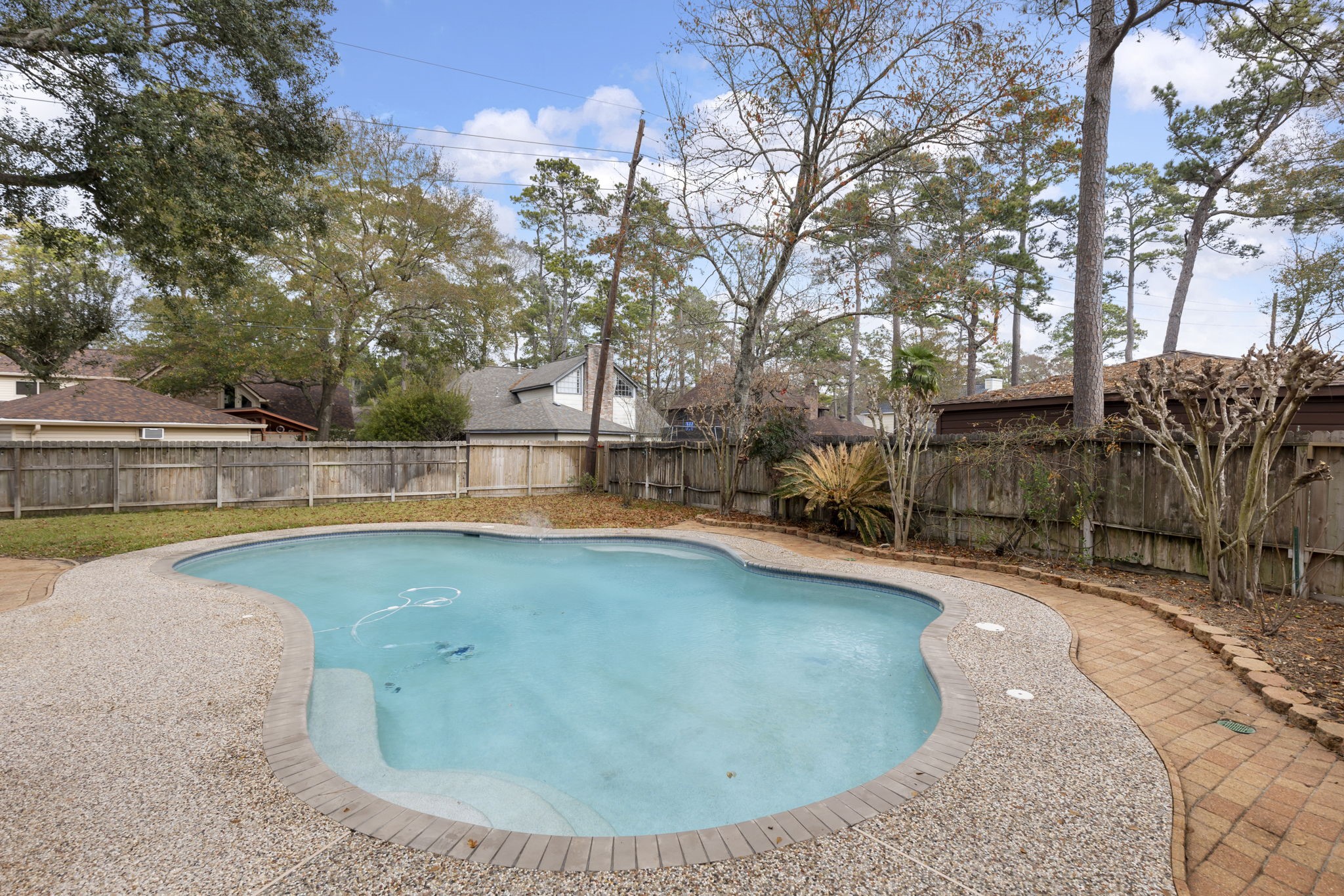 6414 Hickorycrest Drive Spring, TX 77389 - Photo 37 of 49 a view of a swimming pool with an outdoor space