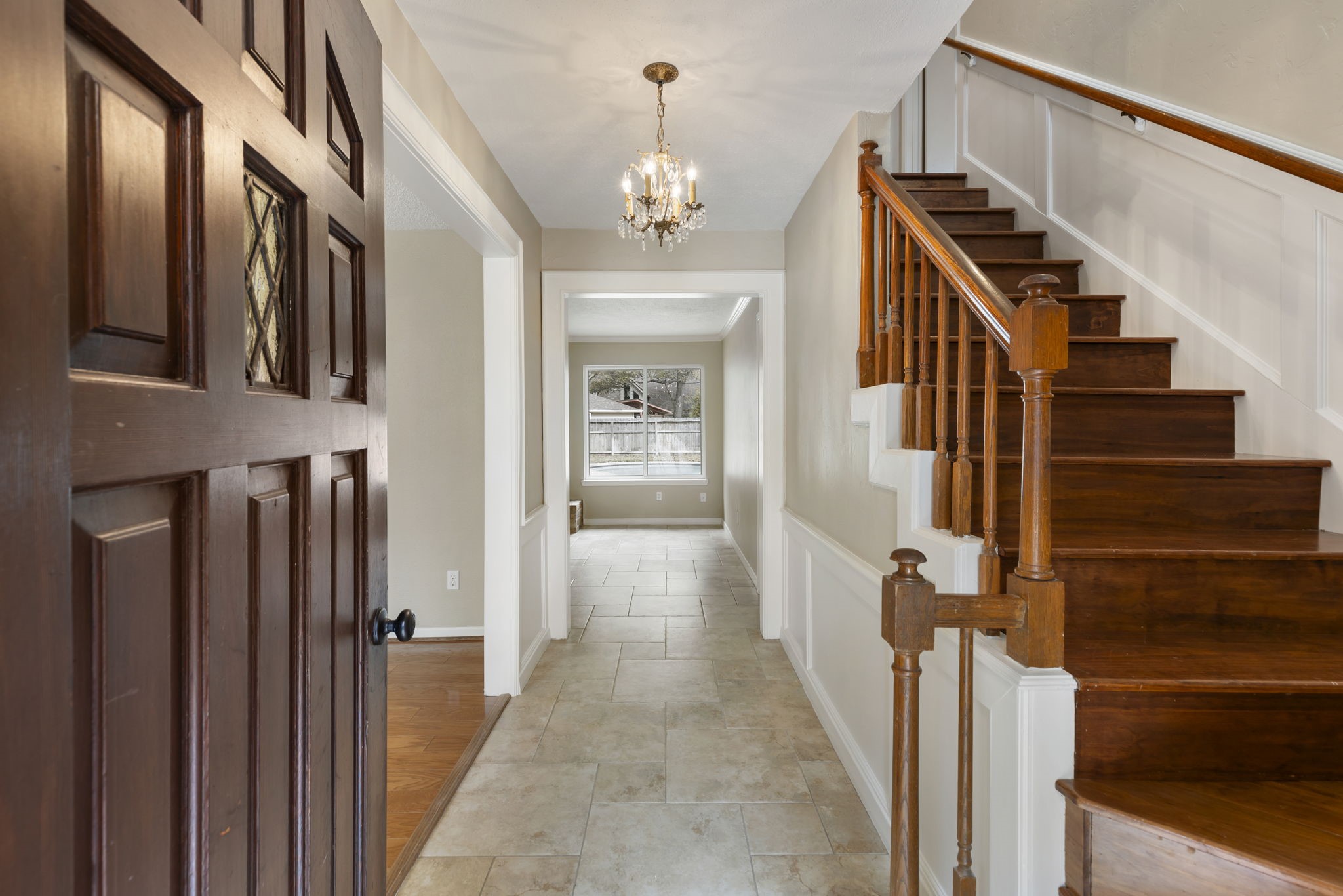 6414 Hickorycrest Drive Spring, TX 77389 - Photo 4 of 49 a view of a hallway with wooden floor and staircase