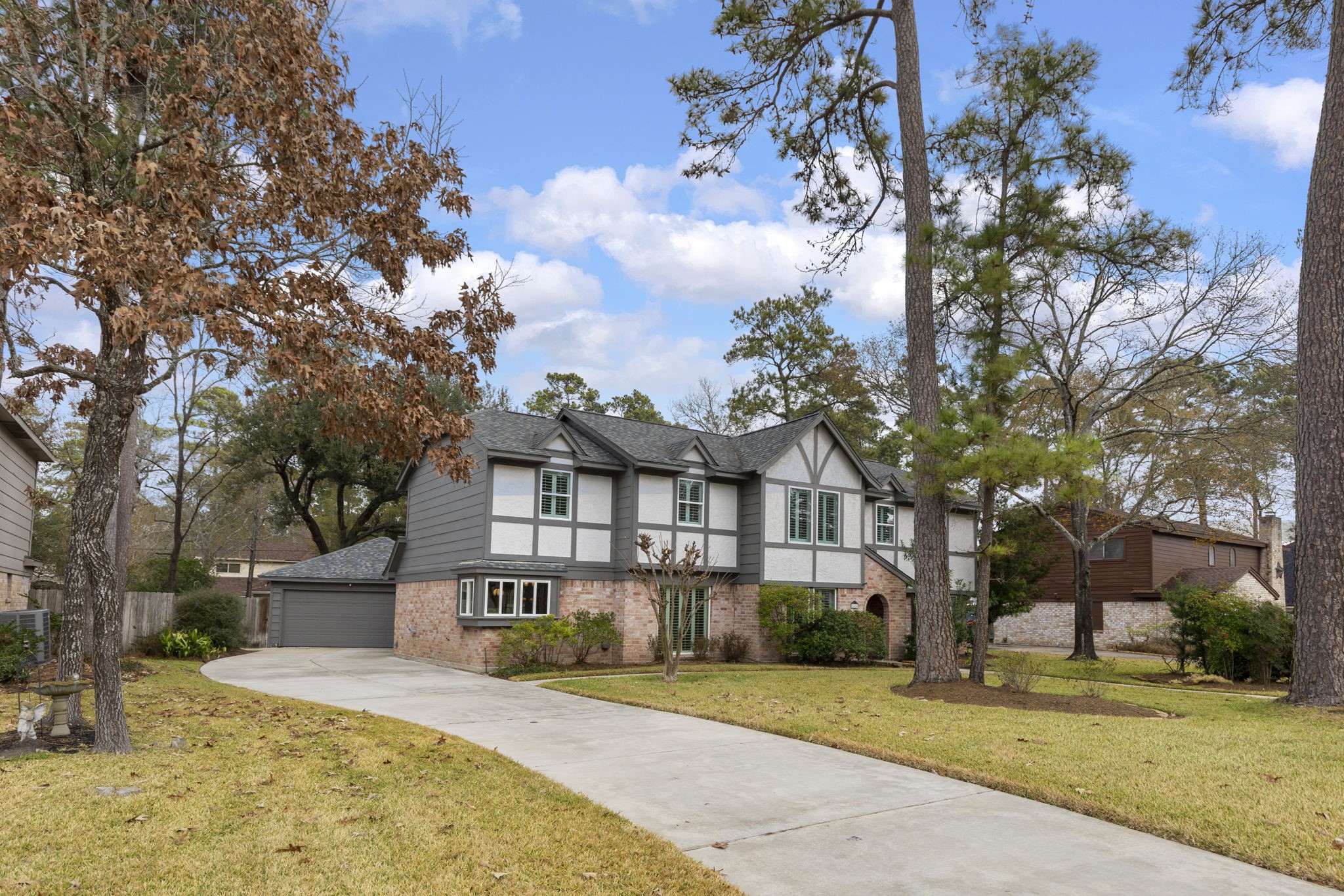 6414 Hickorycrest Drive Spring, TX 77389 - Photo 4 of 49 a front view of a house with a yard and garage