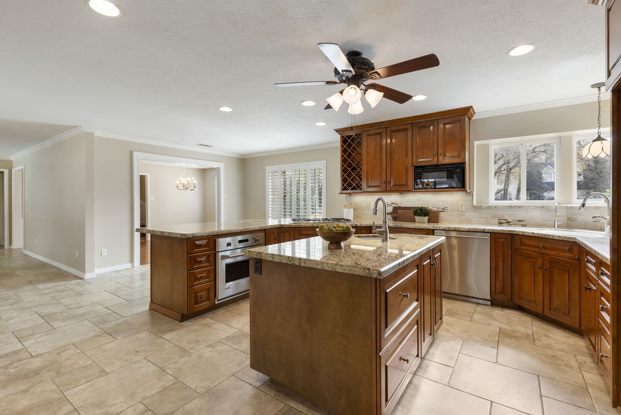 6414 Hickorycrest Drive Spring, TX 77389 - Photo 7 of 49 a kitchen with kitchen island granite countertop a sink counter top space appliances and a window