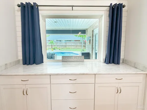 a kitchen with a sink and a large window