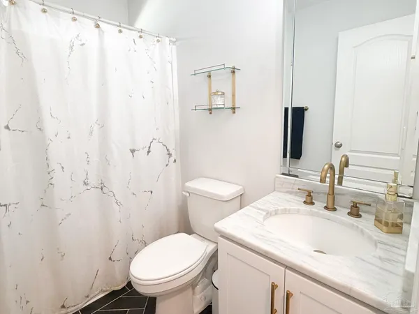 a bathroom with a sink and a toilet