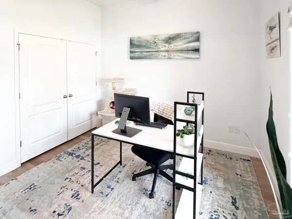 a view of a workspace with furniture