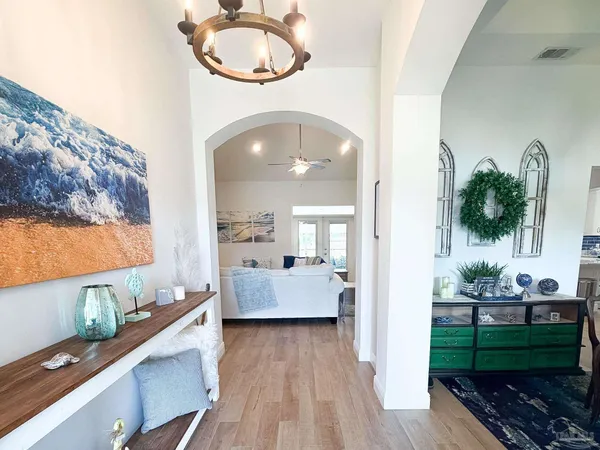 a view of living room kitchen and entryway