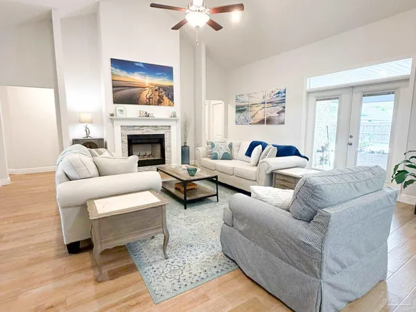 a living room with furniture and a fireplace