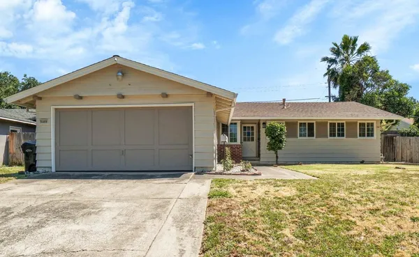 a front view of a house with yard