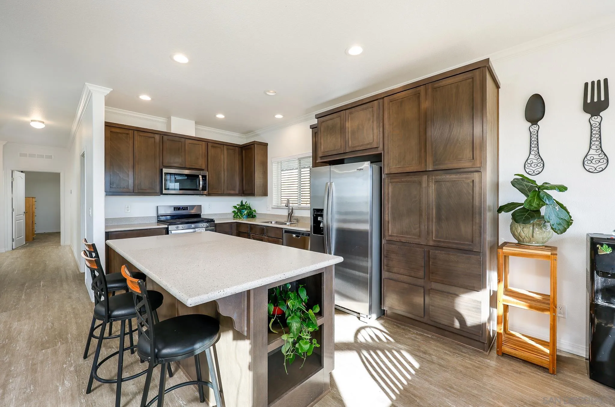 250 La Cresta Heights Road, Unit SPC 12 El Cajon, CA 92021 - Photo 2 of 36 a kitchen with stainless steel appliances granite countertop a refrigerator a sink a stove a dining table and chairs