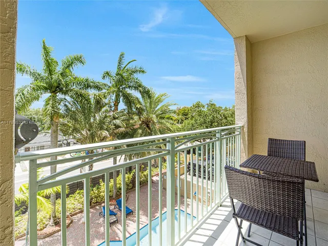 a view of a balcony with furniture