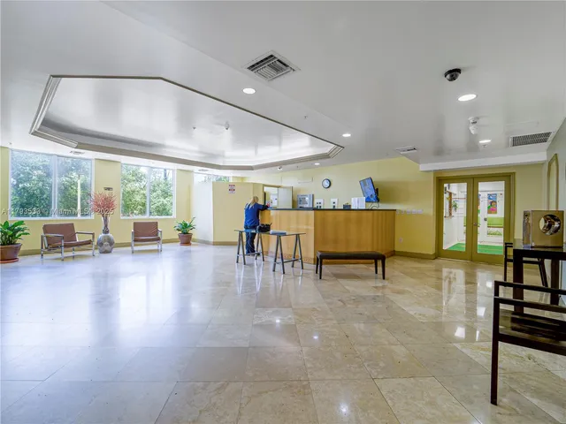 a lobby with furniture and lots of furniture