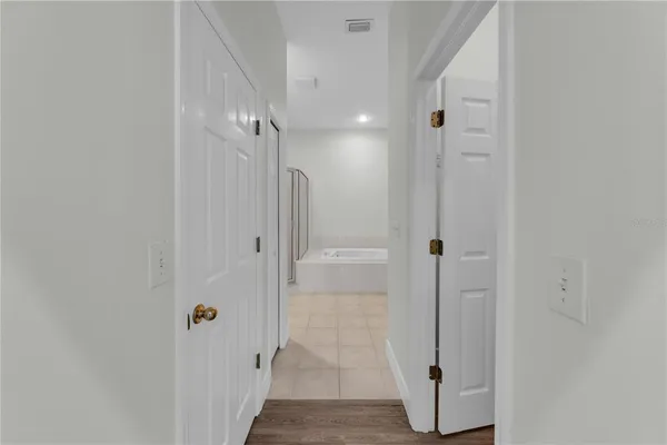 a bathroom with a shower and a glass door