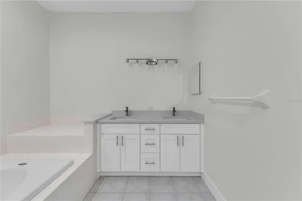a bathroom with a bathtub and a sink