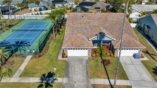 an aerial view of houses with outdoor space