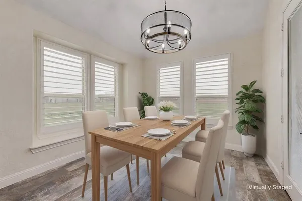 a view of a dining room with furniture window and outside view