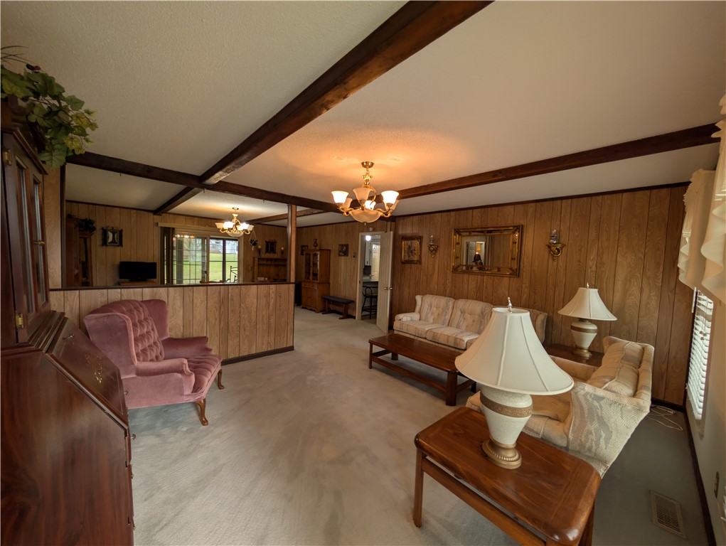 1000 Hickory Lane Anderson, SC 29624 - Photo 2 of 37 This spacious living area features classic wood paneling and exposed beam ceilings.