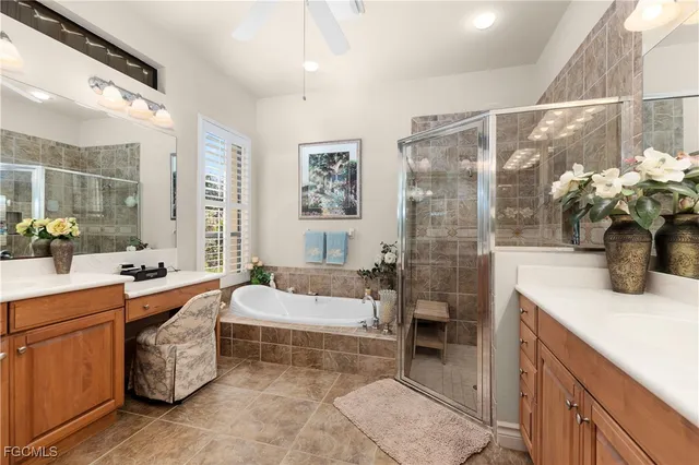 a spacious bathroom with a double vanity sink a large mirror and shower