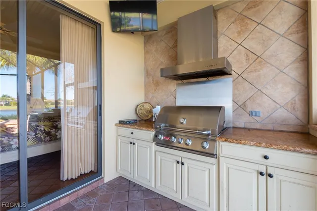 a kitchen with stainless steel appliances granite countertop a stove and a refrigerator