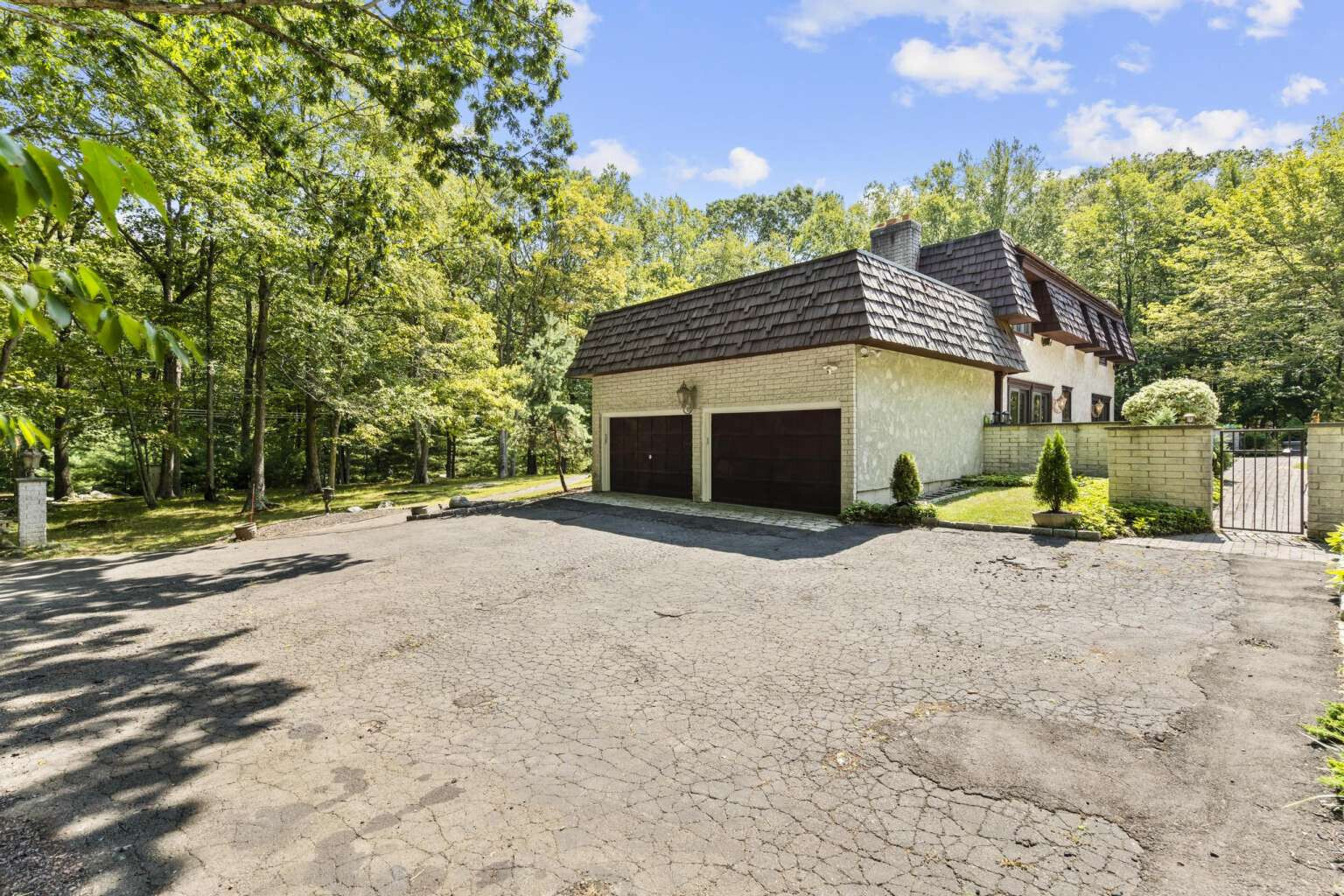 40 Old Quarry Road Woodbridge, CT 06525 - Photo 35 of 39 a front view of a house with a yard and garage