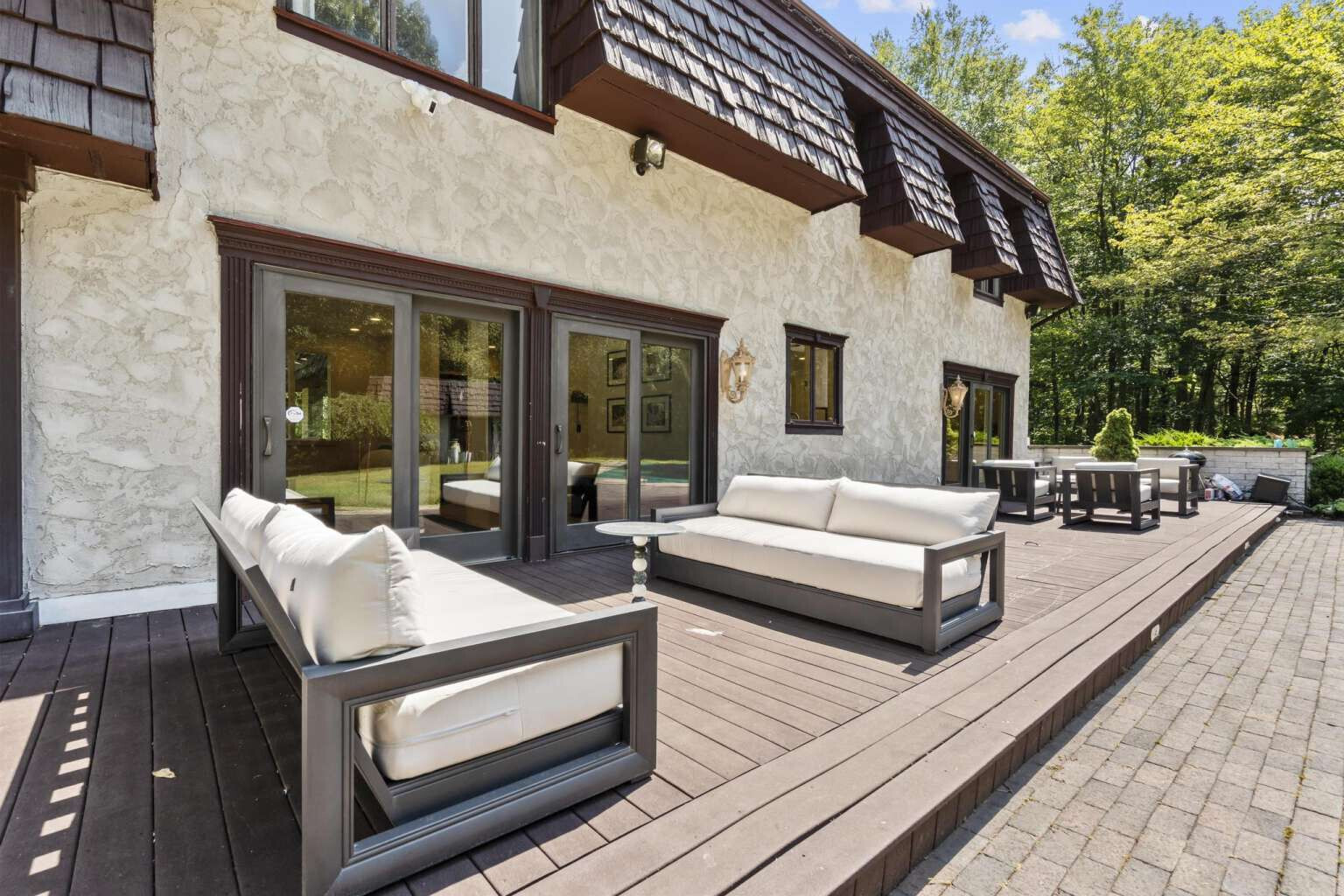 40 Old Quarry Road Woodbridge, CT 06525 - Photo 36 of 39 a view of a patio with couches table and chairs with wooden floor and fence and a potted plant