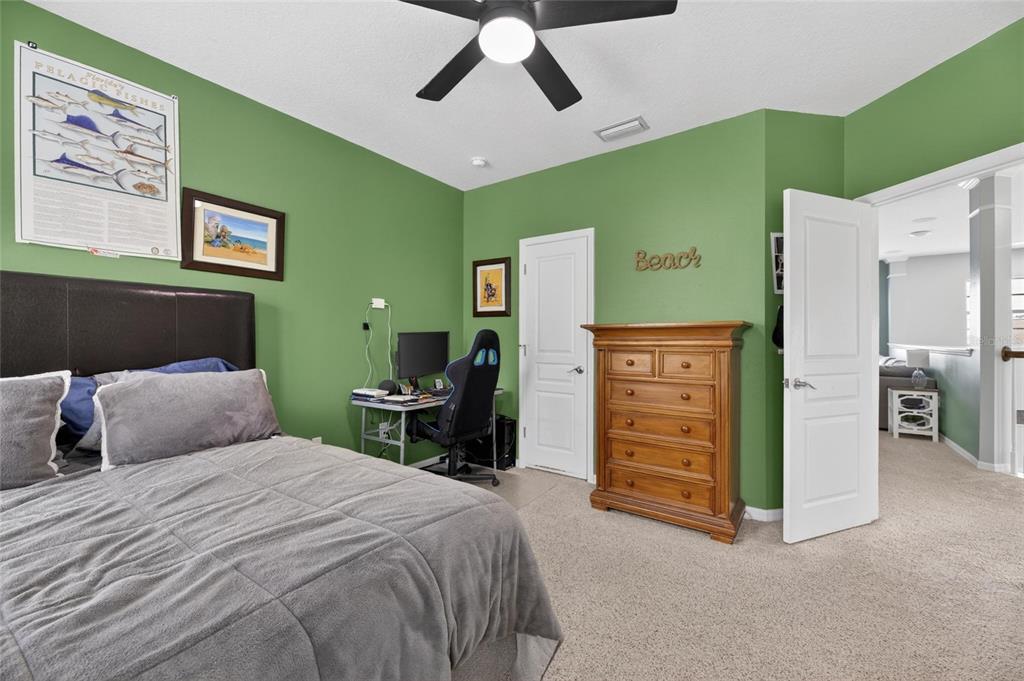 508 Islebay Drive Apollo Beach, FL 33572 - Photo 73 of 98 a bedroom with a bed and a ceiling fan