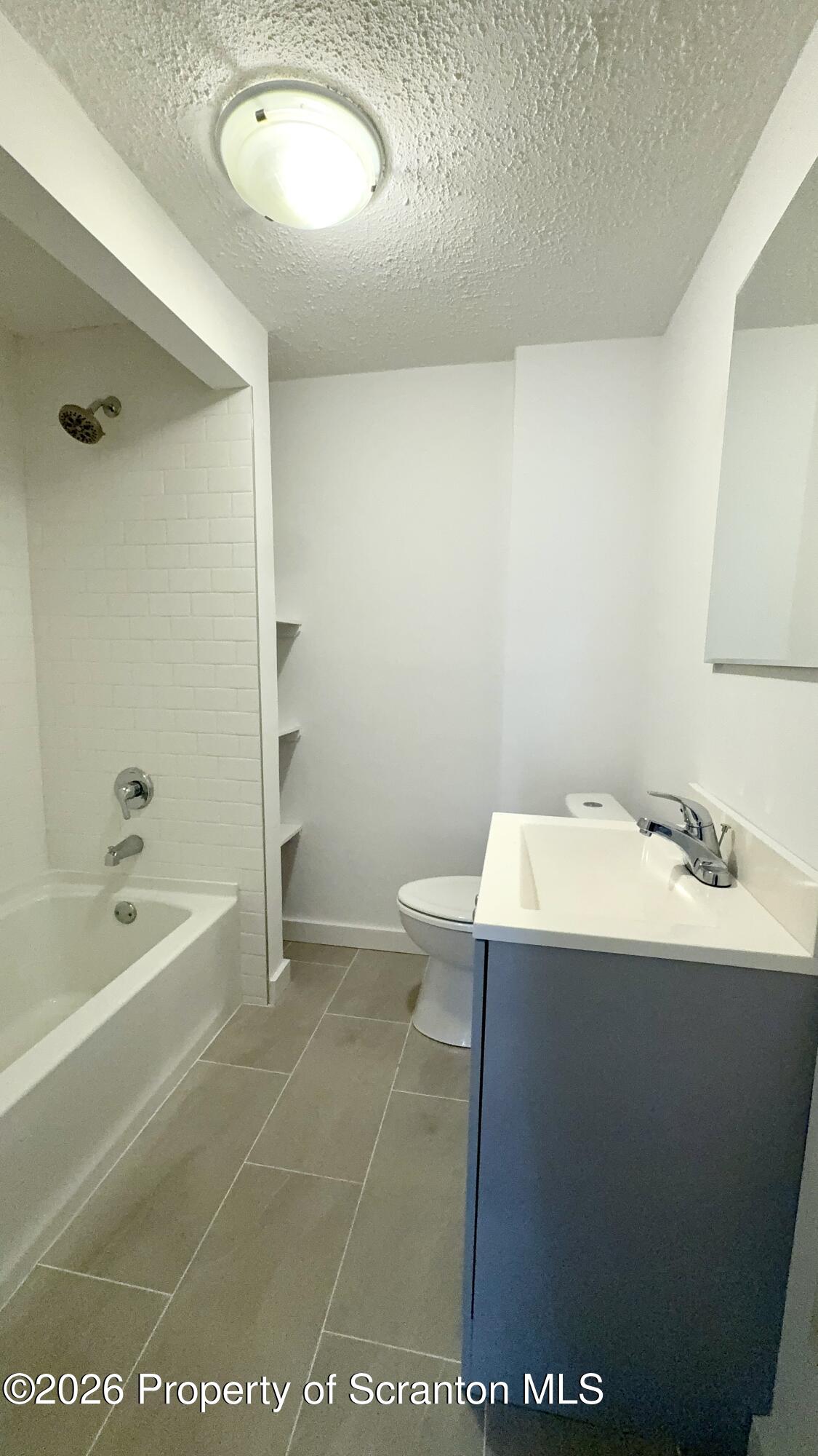 1032 Chestnut Street Sunbury, PA 17801 - Photo 10 of 25 a bathroom with a sink a toilet and bathtub