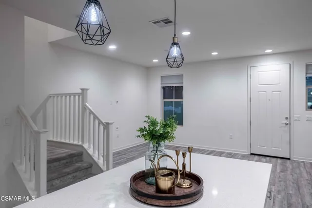 a kitchen with a sink and a refrigerator