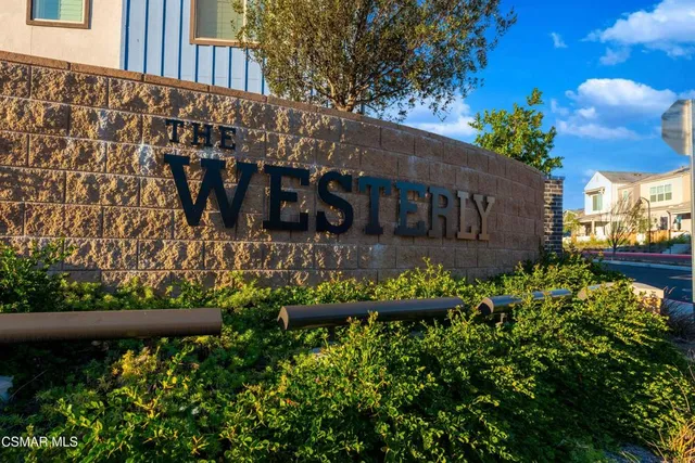 a view of a house with a flower garden