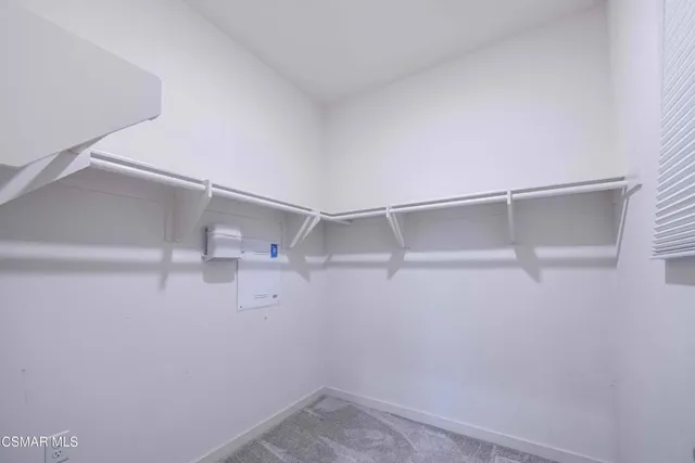 a bathroom with a granite countertop sink a mirror and shower