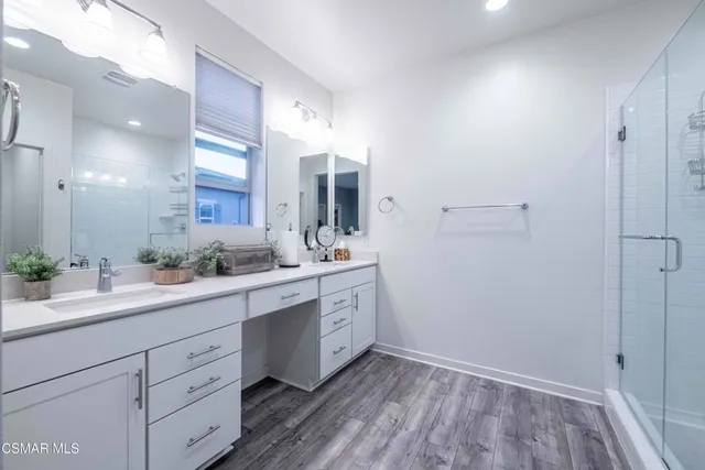 a bathroom with a glass shower door
