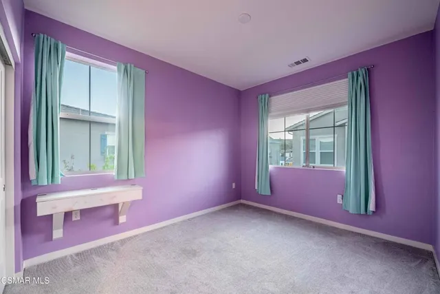 a bathroom with a toilet a sink a tub and a mirror