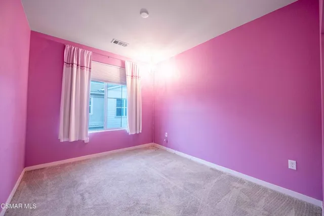 a bathroom with a bathtub and a toilet