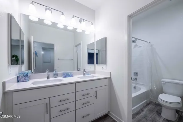 a utility room with sink dryer and washer