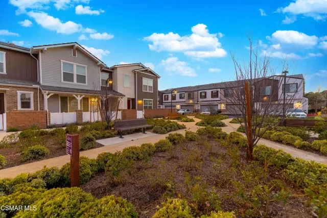 a view of a patio with table and chairs