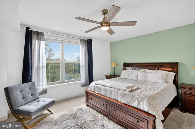 a bedroom with a bed and window