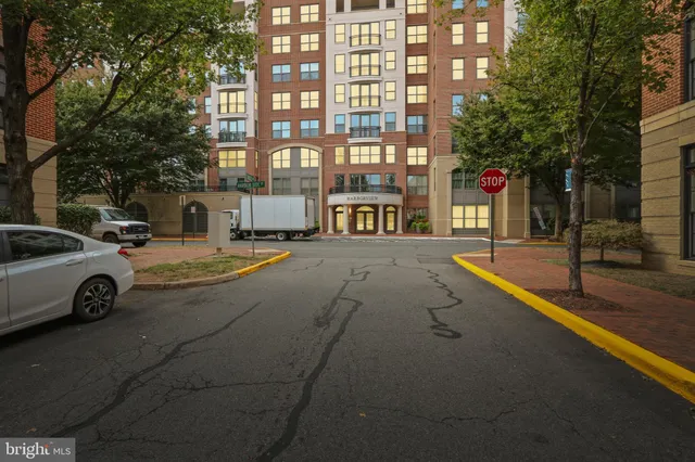 a city street lined with buildings and cars