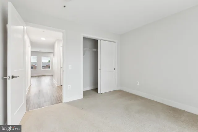 a view of a room with a furniture and mirror
