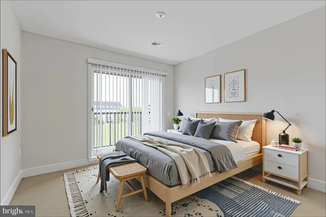 a bed room with a bed and a window