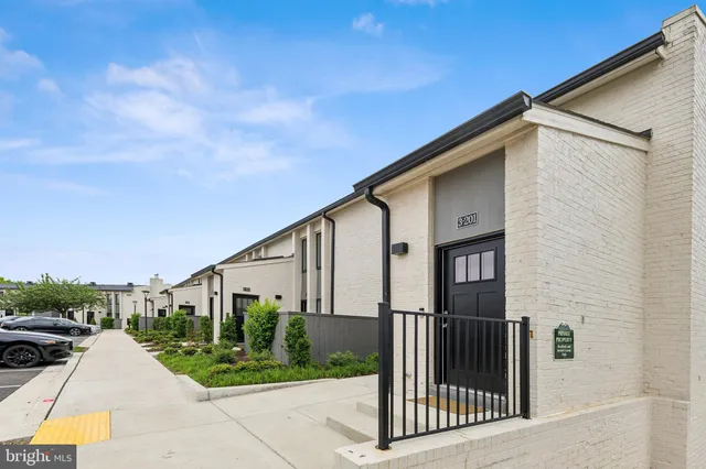 a view of a terrace with couches and sky view