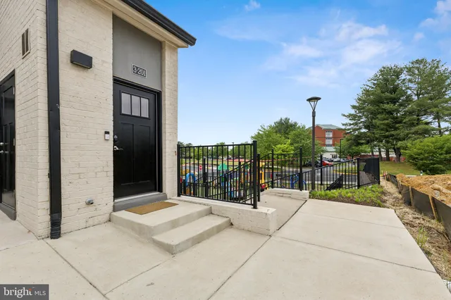 an aerial view of a swimming pool and mountain