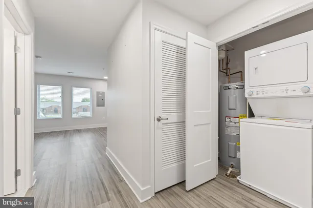a view of hallway with wooden floor