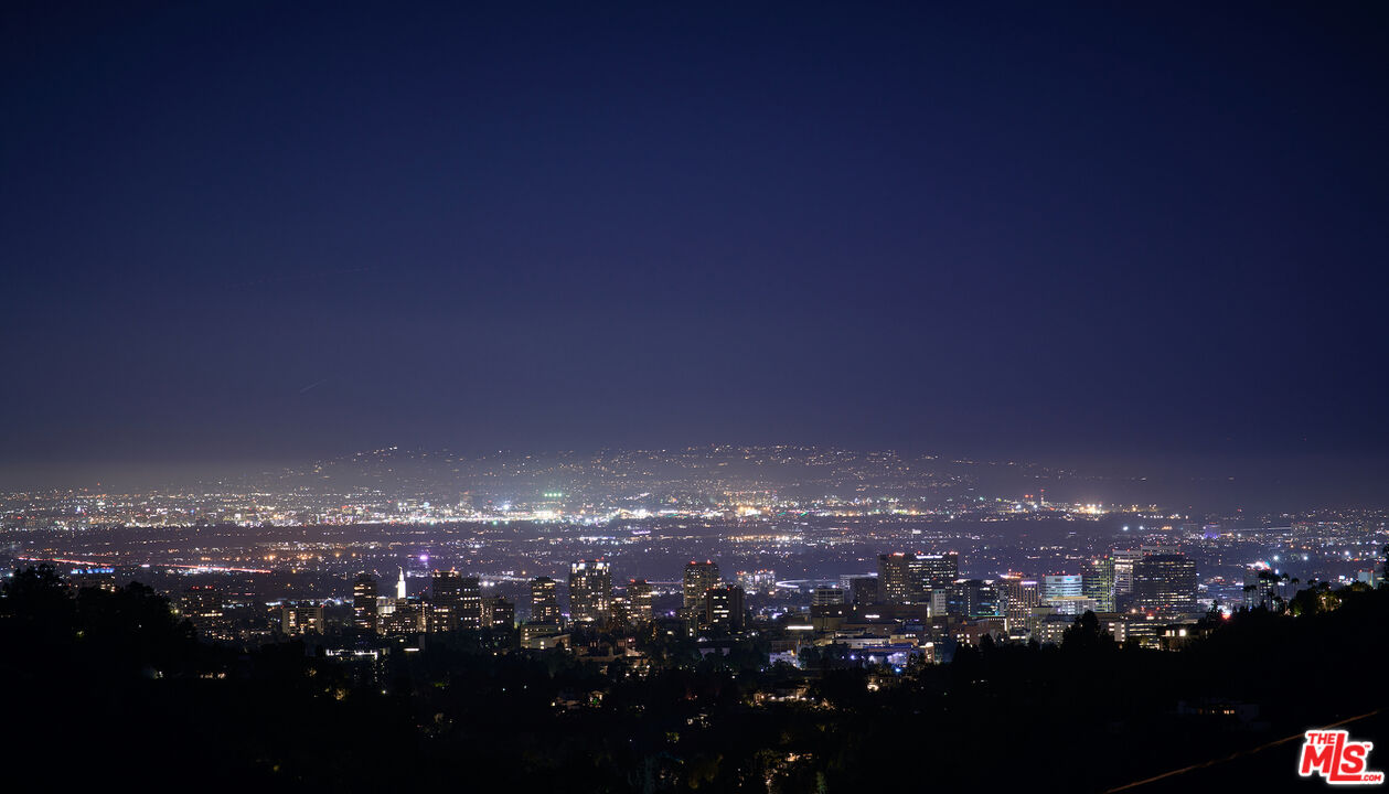 a view of city and green space
