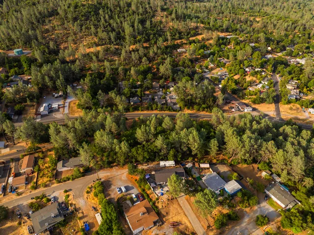 a view of a town with mountains in the background