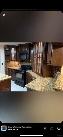 a view of kitchen cabinets and wooden floor
