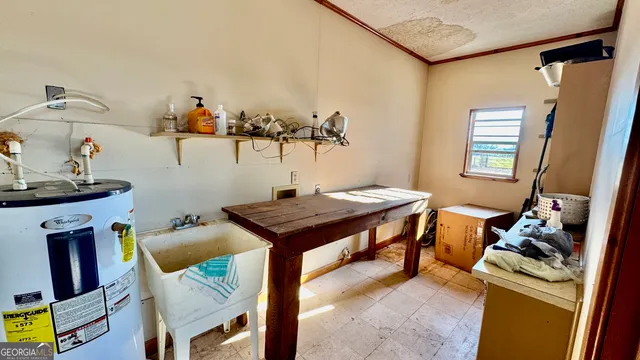 a view of a room that has a table and chairs in it