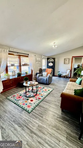 a living room with furniture and a table