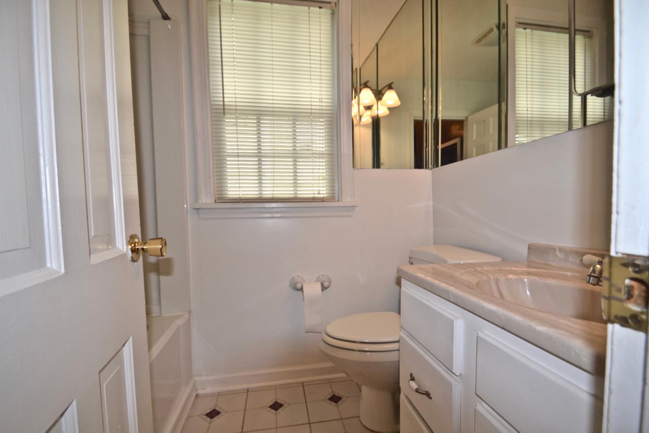 207 Cherokee Road Nashville, TN 37205 - Photo 19 of 24 a bathroom with a sink a toilet and shower