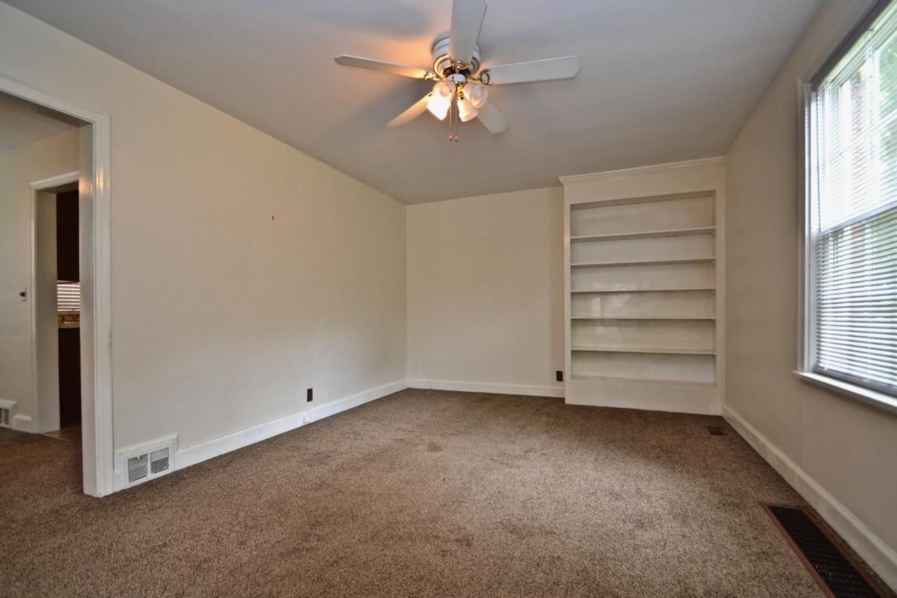 207 Cherokee Road Nashville, TN 37205 - Photo 3 of 24 wooden floor in an empty room with a window