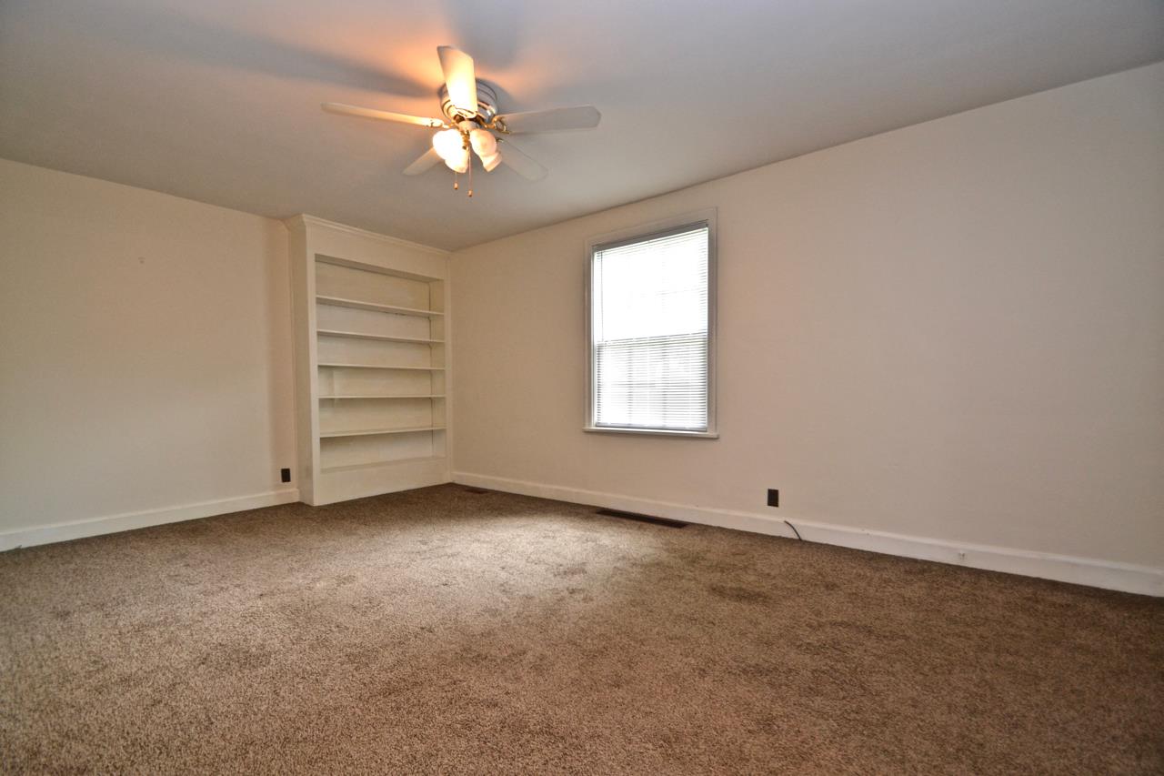 207 Cherokee Road Nashville, TN 37205 - Photo 4 of 24 an empty room with windows and ceiling fan