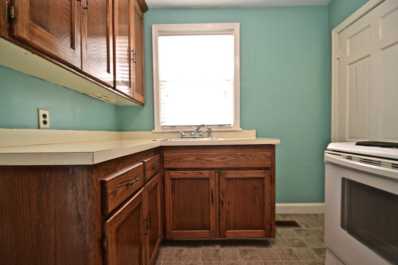 207 Cherokee Road Nashville, TN 37205 - Photo 7 of 24 a kitchen with a sink and a window