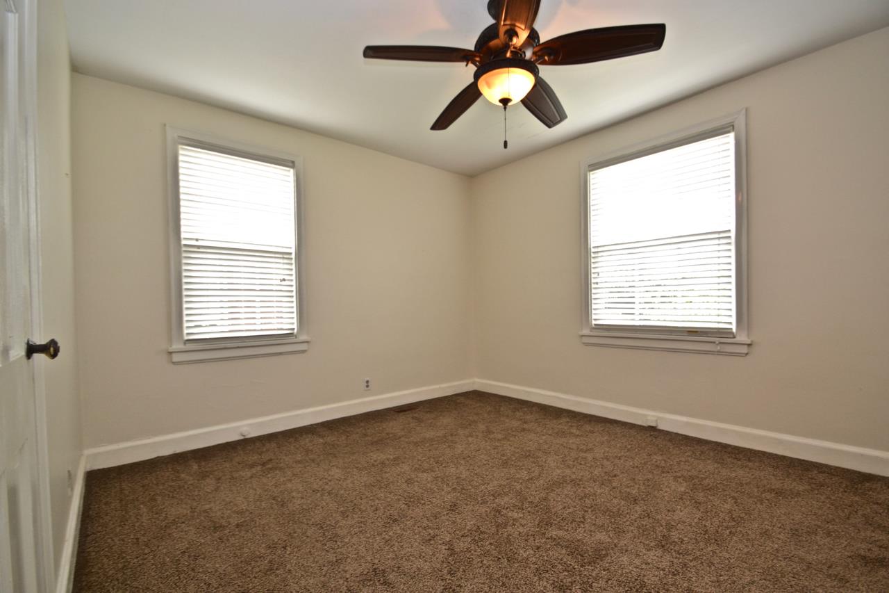 207 Cherokee Road Nashville, TN 37205 - Photo 9 of 24 an empty room with windows and fan