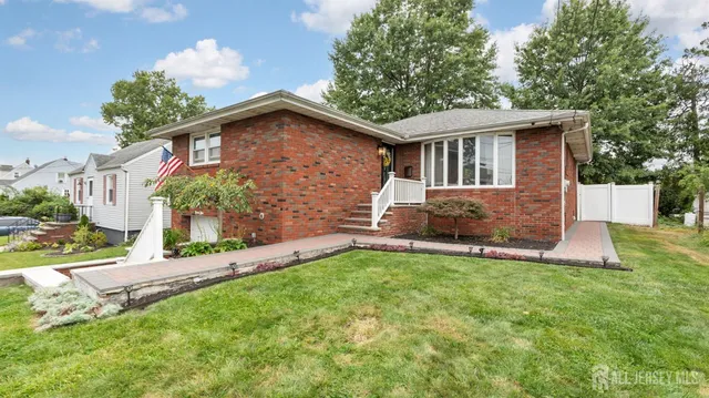 a view of a bathroom with wooden floor and windows